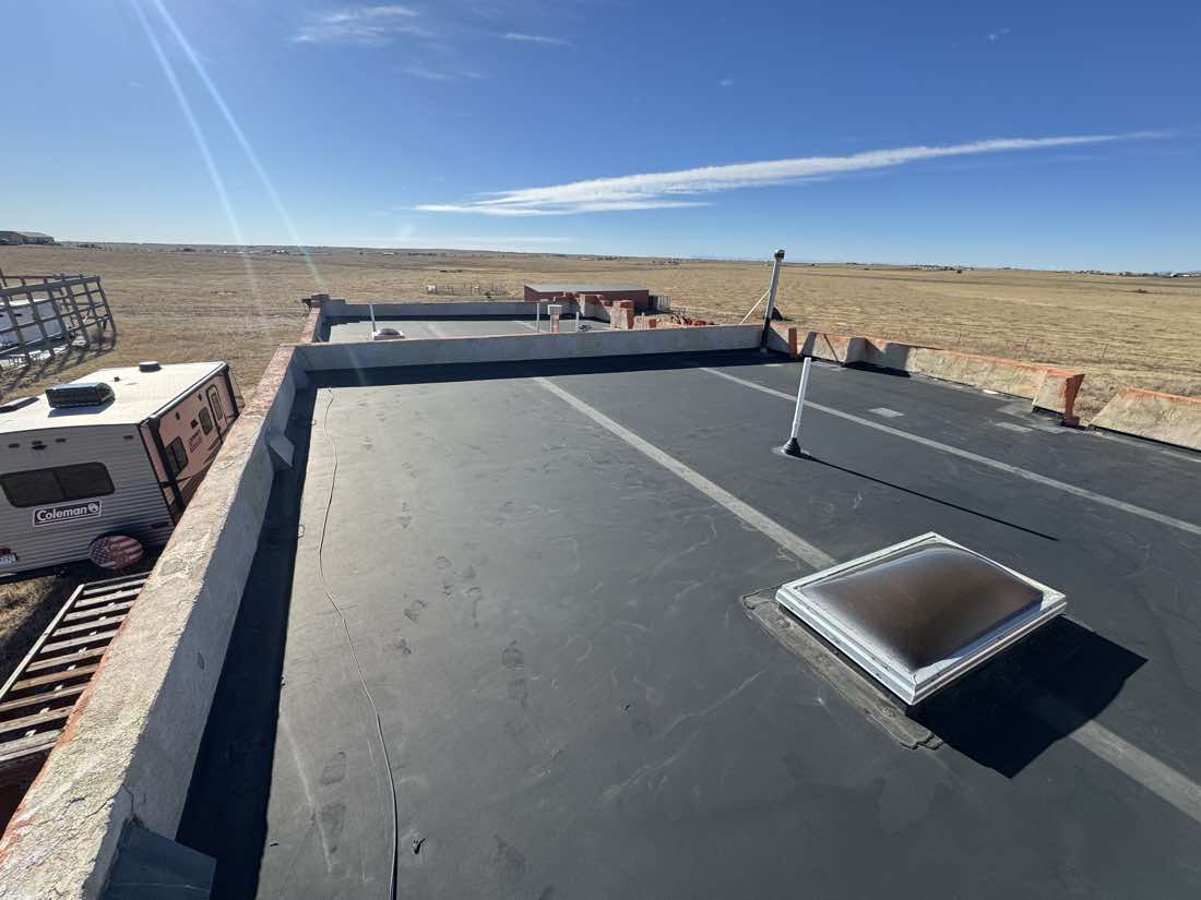 Flat roof with newly flashed skylight