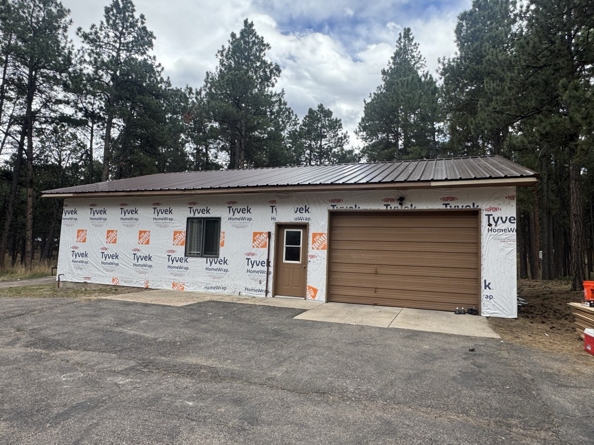 New construction garage with a metal roof