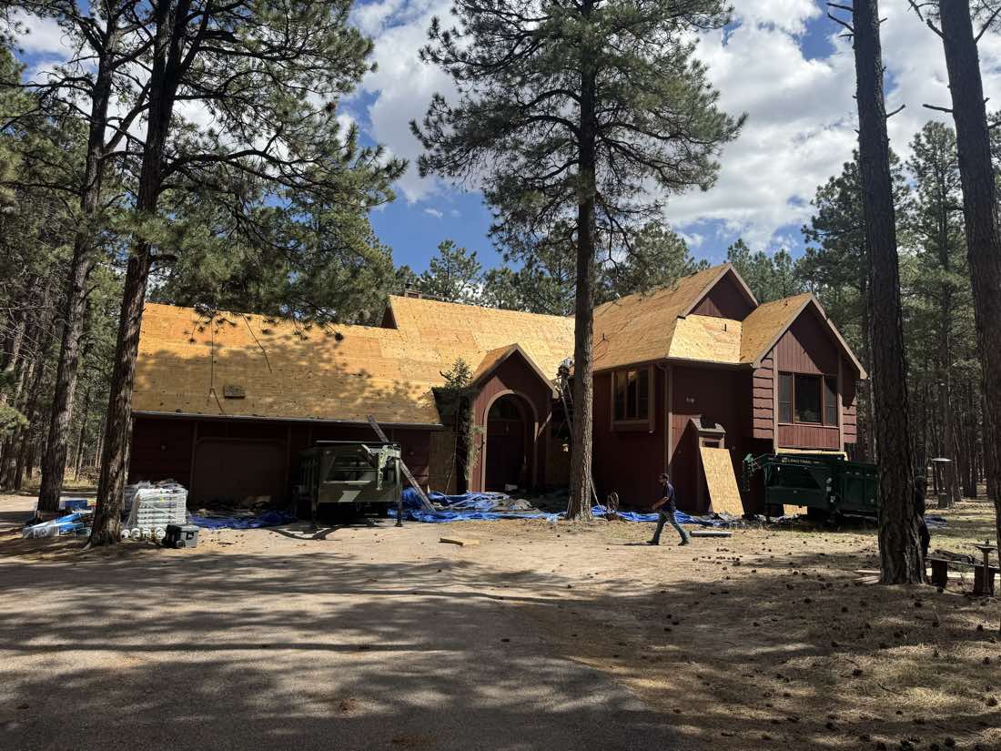 New roof decking being installed mid-project