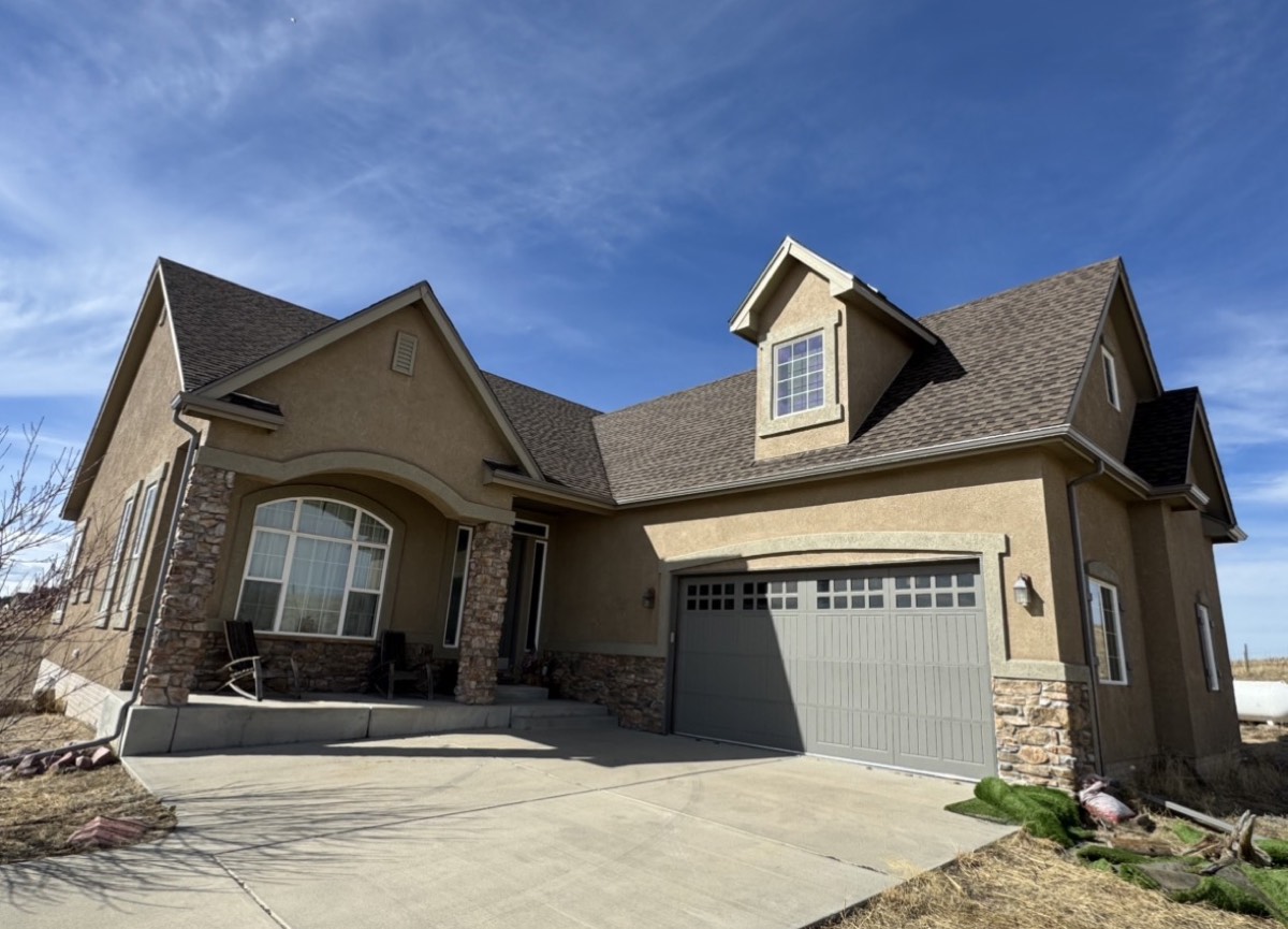 New shingle roof on a stucco home